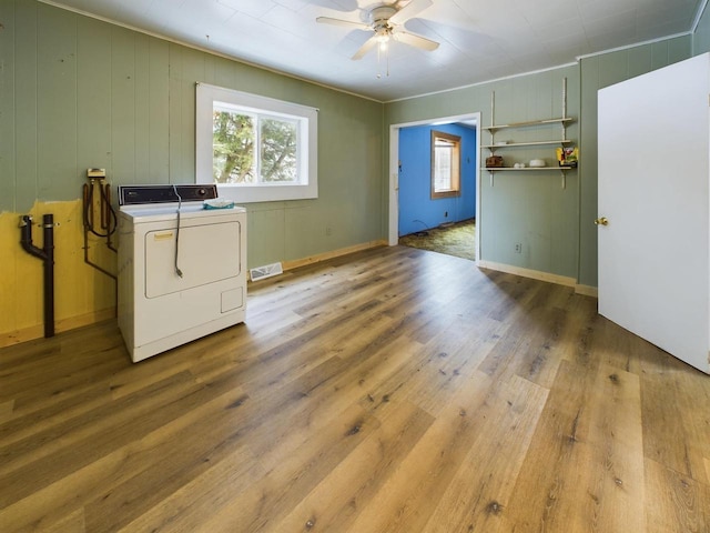 laundry room featuring ceiling fan, light hardwood / wood-style floors, and washer and dryer