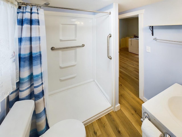 bathroom with vanity, curtained shower, and wood-type flooring