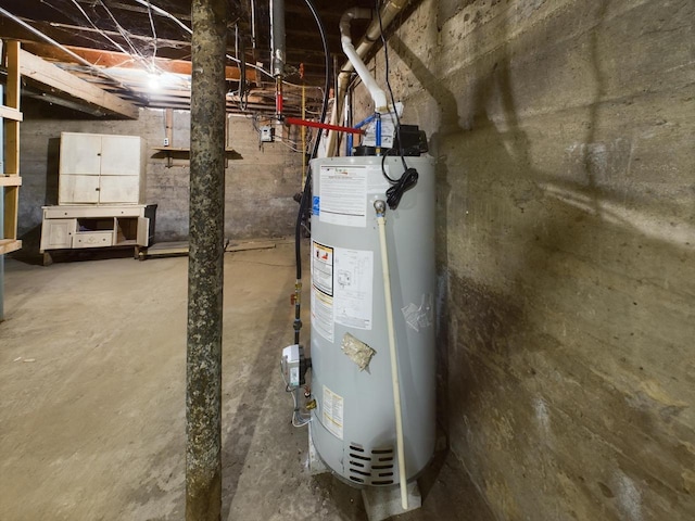 utility room featuring gas water heater