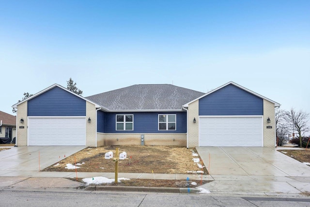 ranch-style house featuring a garage