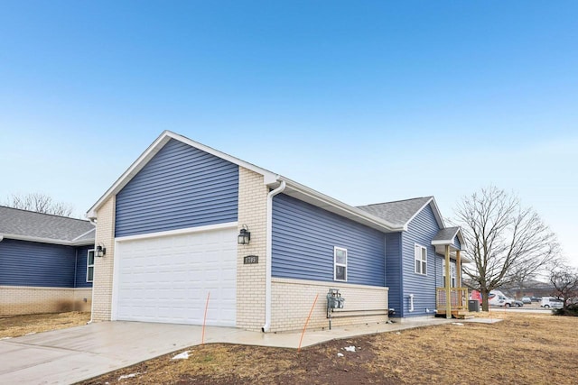 view of side of property featuring a garage