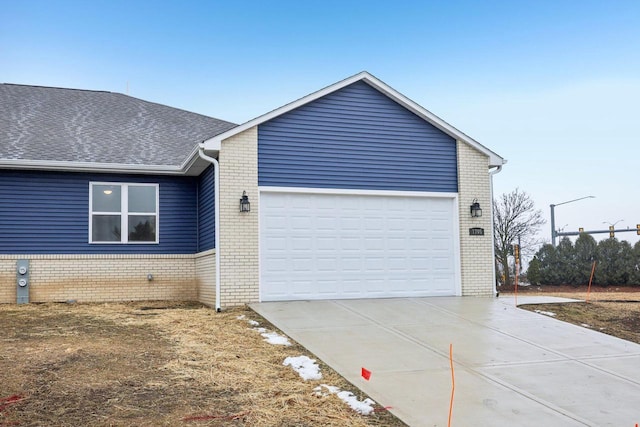 view of side of home featuring a garage