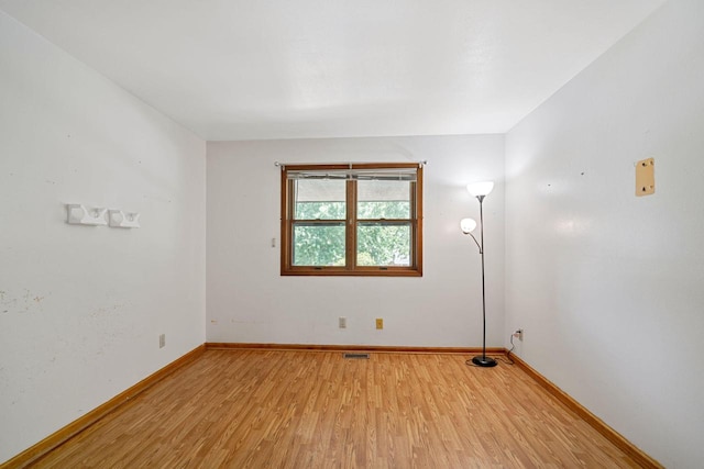 spare room featuring hardwood / wood-style flooring