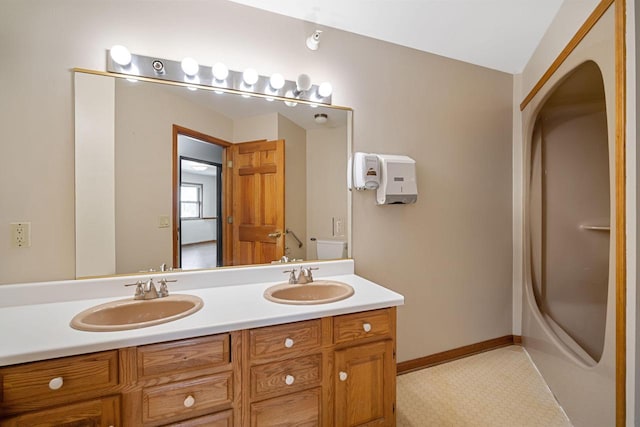 bathroom with vanity and a shower with shower door