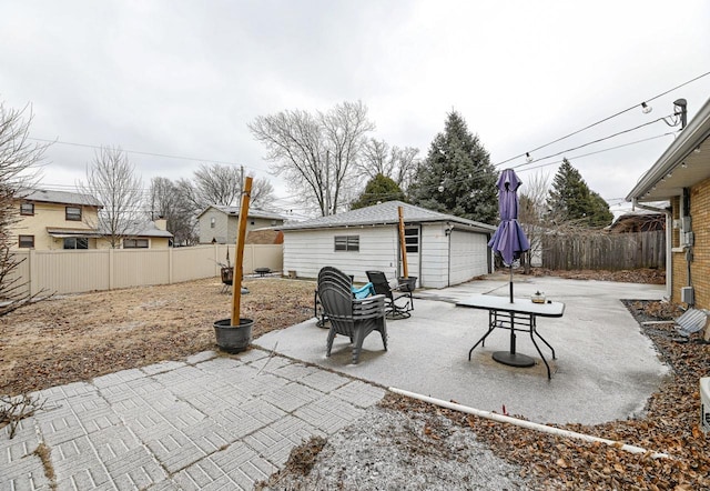 view of patio / terrace featuring a garage and an outdoor structure