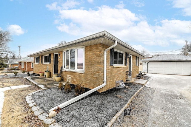 view of property exterior with an outbuilding and a garage