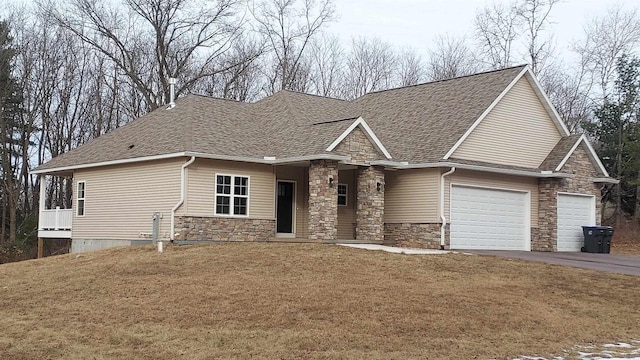 view of front of property with a garage and a front yard