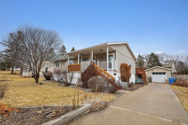 view of front of house featuring an outbuilding, a garage, a front lawn, and a porch