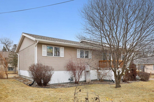 view of home's exterior with a yard