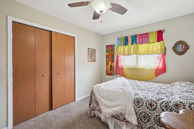 bedroom featuring a closet, ceiling fan, and carpet flooring