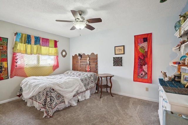 carpeted bedroom featuring ceiling fan and a textured ceiling