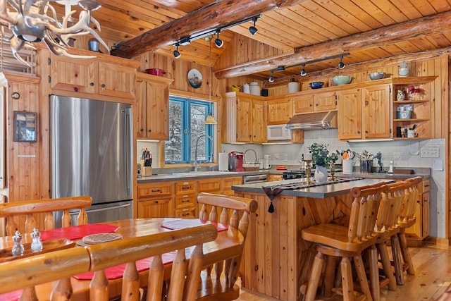 kitchen featuring sink, wood ceiling, backsplash, beam ceiling, and stainless steel appliances