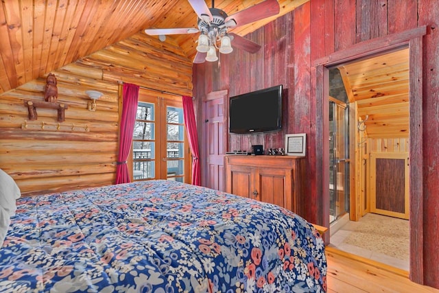 bedroom featuring log walls, lofted ceiling, wooden ceiling, and ceiling fan