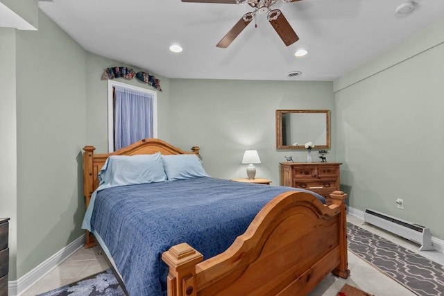 bedroom featuring a baseboard heating unit, light tile patterned floors, and ceiling fan