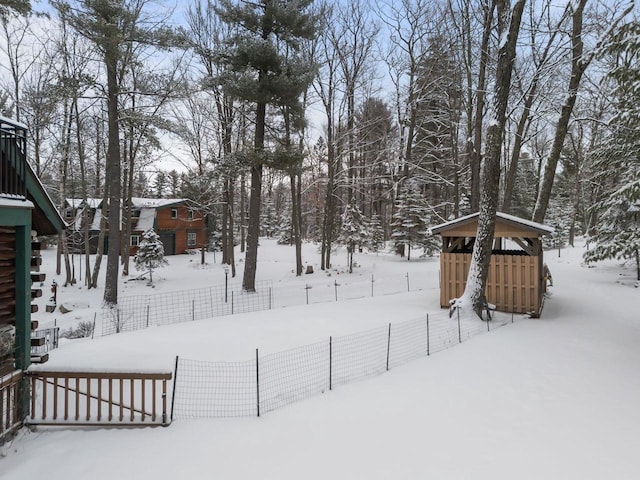 view of yard covered in snow