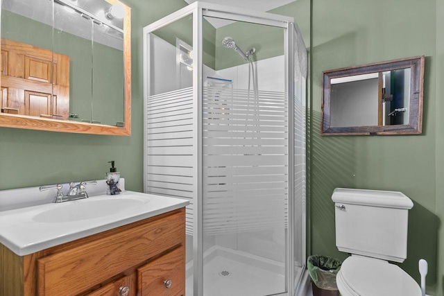 bathroom with vanity, toilet, and walk in shower