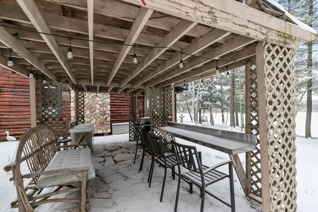 view of snow covered patio