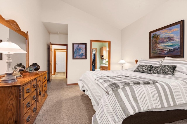 carpeted bedroom with vaulted ceiling