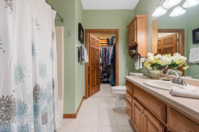 bathroom featuring vanity, toilet, and tile patterned flooring