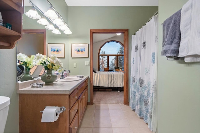 bathroom with vanity, tile patterned floors, and toilet