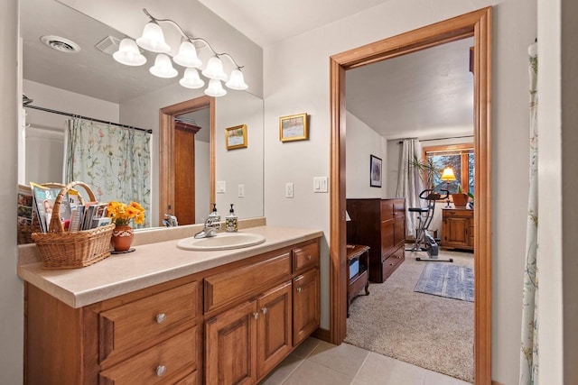 bathroom featuring tile patterned flooring and vanity