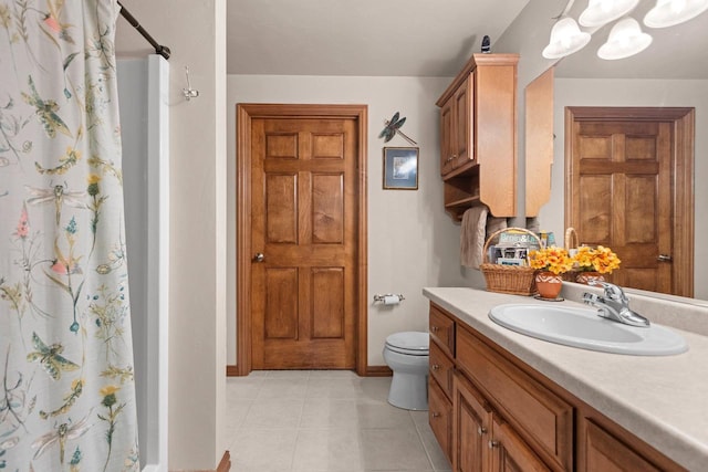 bathroom featuring vanity, toilet, curtained shower, and tile patterned flooring