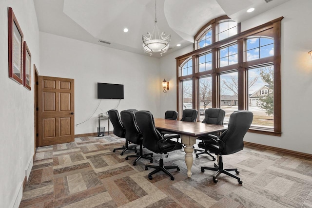 carpeted office featuring high vaulted ceiling