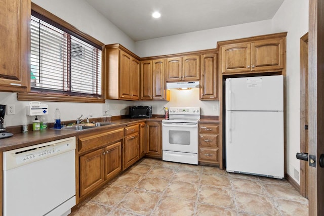 kitchen with sink and white appliances