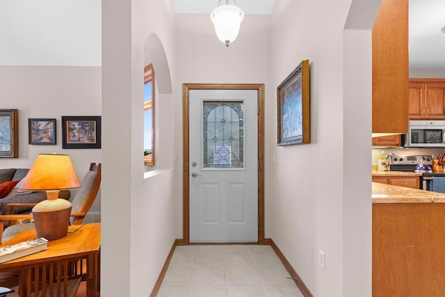 entryway featuring light tile patterned floors