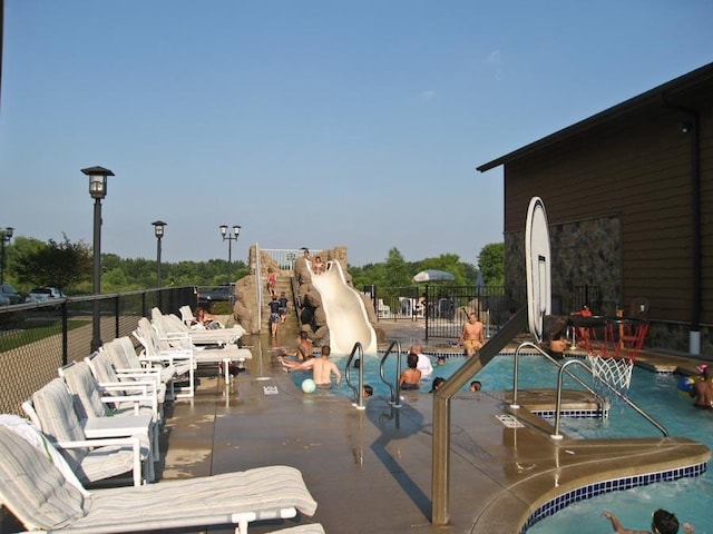 view of swimming pool with a patio