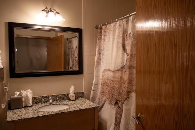 bathroom featuring vanity and a shower with curtain