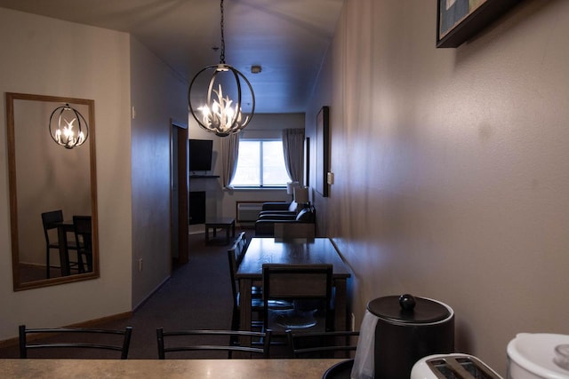 dining area with an inviting chandelier