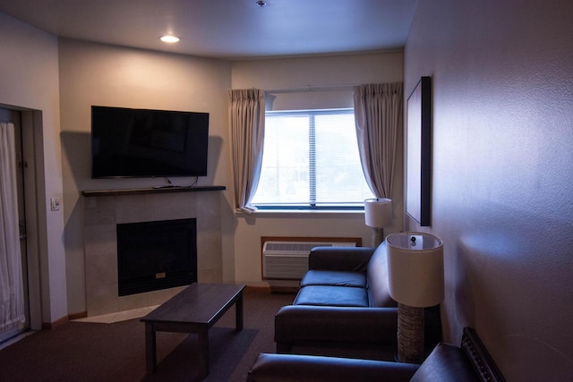 carpeted living room featuring a wall mounted air conditioner and a tile fireplace