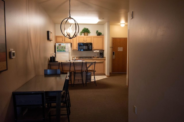 view of carpeted dining space