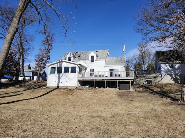 back of property featuring a deck