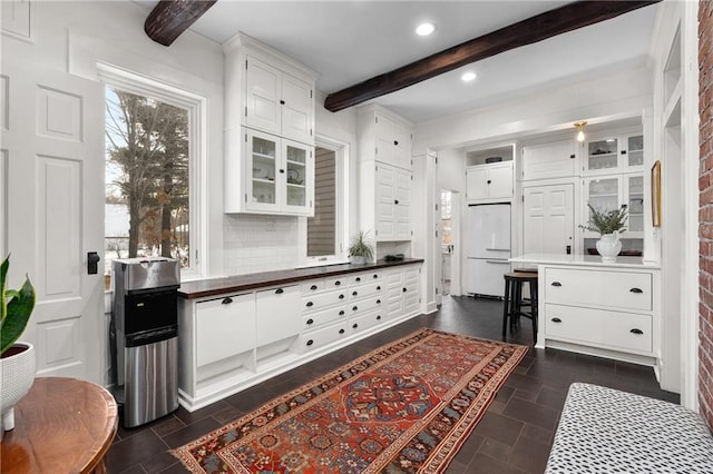 mudroom featuring beamed ceiling