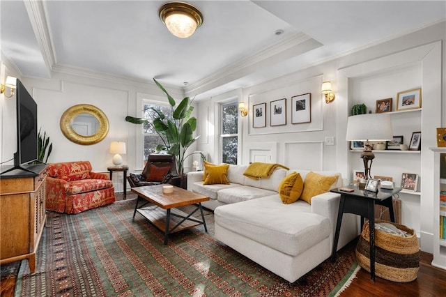 living area with hardwood / wood-style flooring and ornamental molding