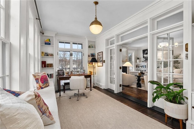 home office featuring french doors and ornamental molding