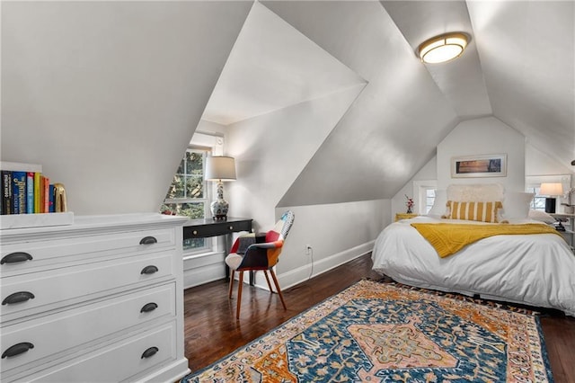 bedroom with lofted ceiling and dark hardwood / wood-style floors