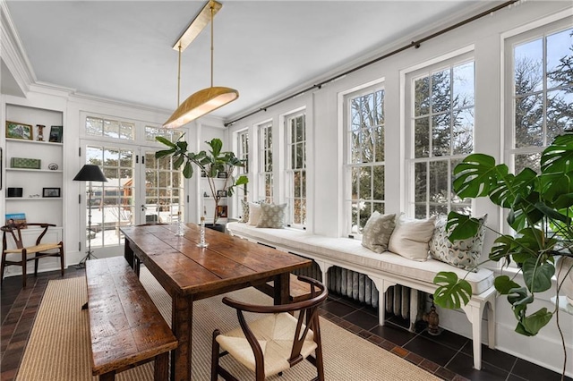 sunroom / solarium with a wealth of natural light and french doors