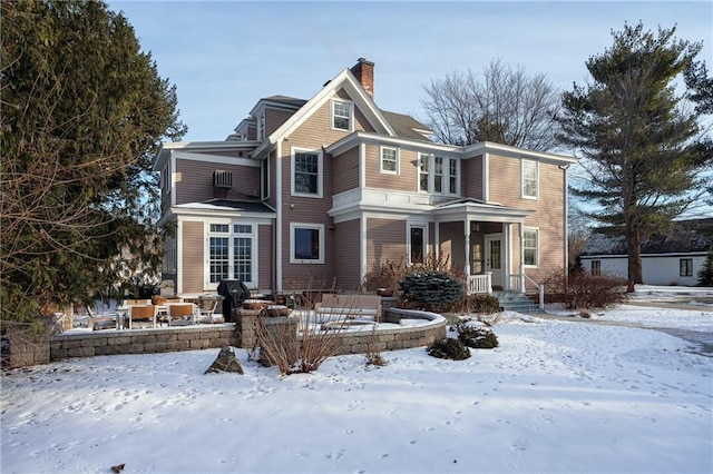 view of snow covered house