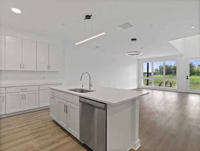 kitchen featuring sink, white cabinetry, an island with sink, decorative light fixtures, and stainless steel dishwasher