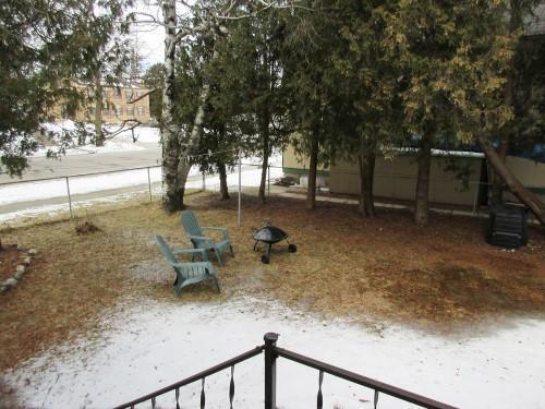 view of yard layered in snow