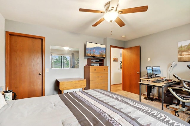 bedroom featuring ceiling fan and light colored carpet