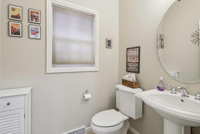 bathroom with toilet and sink