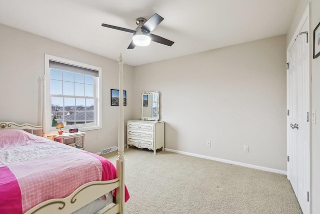 bedroom with ceiling fan and carpet floors