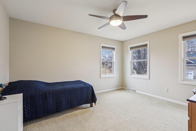 carpeted bedroom featuring ceiling fan