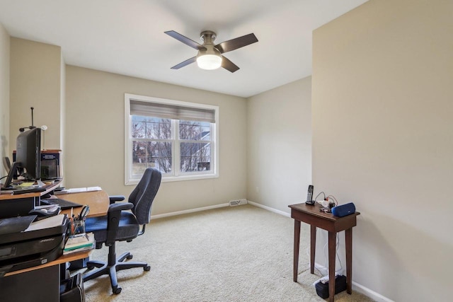 home office featuring ceiling fan and carpet flooring