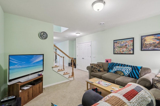 living room with light carpet and a skylight