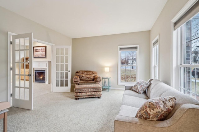 living room with carpet floors and french doors